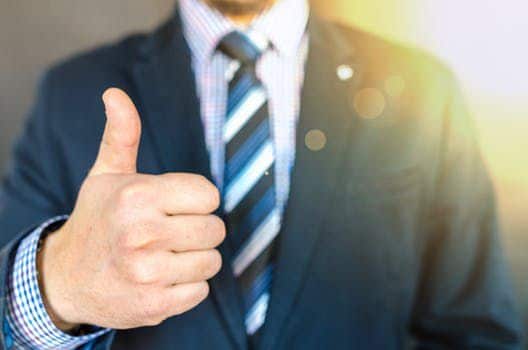 An image of a man's thumbs up from F&I department dealership